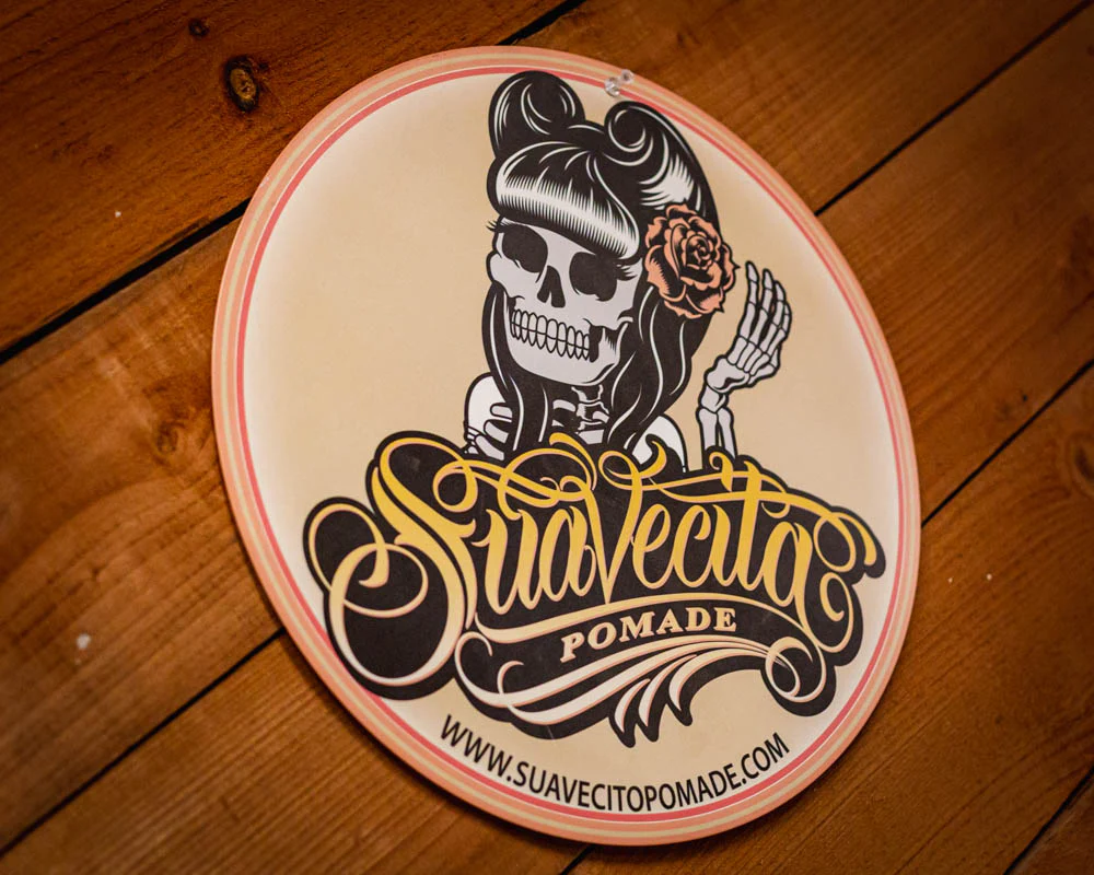 Suavecita Top Logo Embossed Metal Sign - Image 2